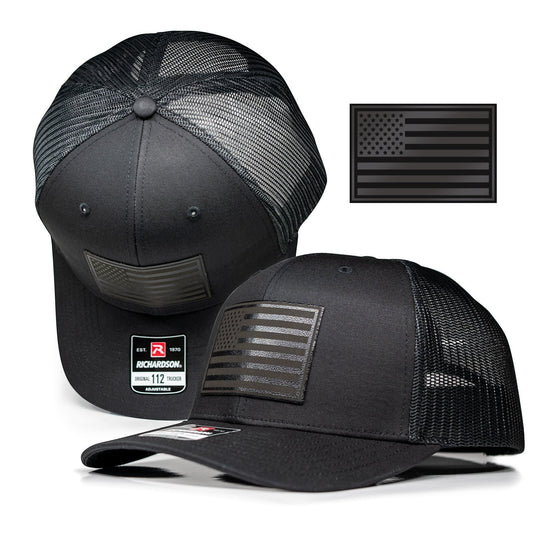 Single Track Hats black trucker cap with black USA flag leatherette patch. Adjustable snapback, one size fits most.
